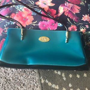 Beijo patent turquoise handbag.